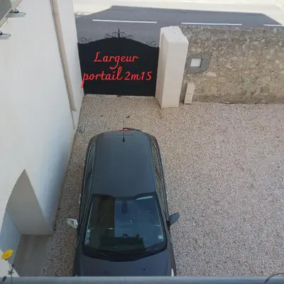 a car parked in front of a parking garage at Love Room Emoi de toi in Sigean