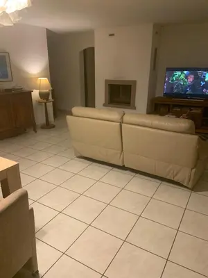 a living room with a couch and a tv at les amandiers in Salses-le-Chateau