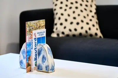 two boxes of toothpaste sitting on a table at La Villa Orange - Proche cité médiévale et centre ville à pied in Carcassonne