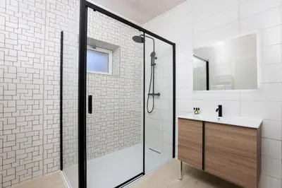 a bathroom with a shower and a sink at L'Impasse d'Adam Free Parking in Carcassonne