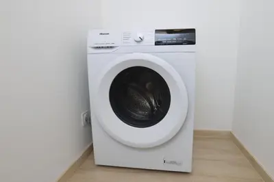 a white washing machine sitting in a room at L'Impasse d'Adam Free Parking in Carcassonne