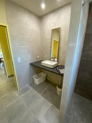 a bathroom with a sink and a mirror at T3 Gîte le Canigou in Trévillach