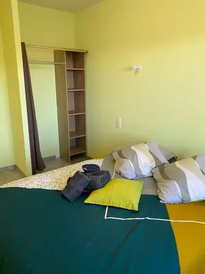 a bedroom with a bed with pillows on it at T3 Gîte le Canigou in Trévillach