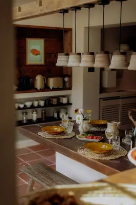 a kitchen counter with plates and dishes on it at Pausette in Fanjeaux