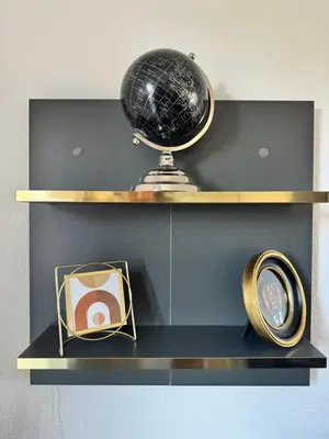 a shelf with a globe and a picture on it at Narb'home, Cosy , Parking, Balcon in Narbonne