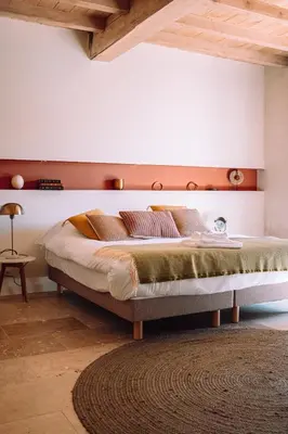 a bedroom with a large bed in a room at Chambre tout confort à l'Héritier - au coeur du Tarn in Marzens