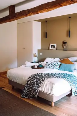 a bedroom with a large bed in a room at Chambre tout confort à l'Héritier - au coeur du Tarn in Marzens