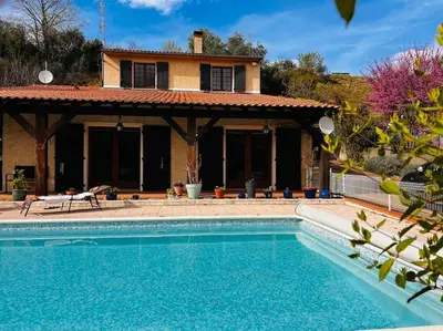 a house with a swimming pool in front of a house at Belle Villa 4 bed, sud de la France in Limoux
