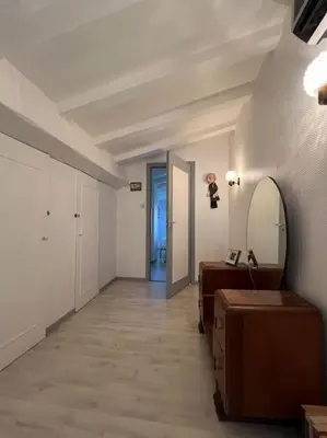 a hallway with a bathroom with a mirror and a sink at Belle Villa 4 bed, sud de la France in Limoux
