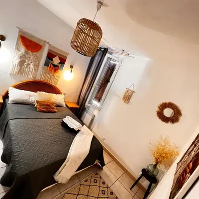 a bedroom with a large bed in a room at Maison de vacances spa in Narbonne