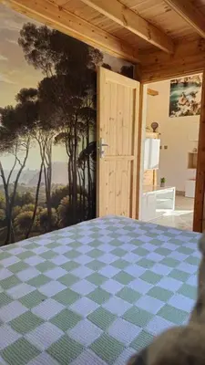 a room with a checkered floor and an open door at Chalet détente in Montaut