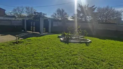 a fountain in the middle of a grass field at Chalet détente in Montaut