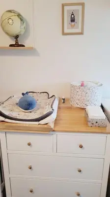 a white dresser with a wooden counter top with aumedumed at Chalet - Beach House in Gruissan