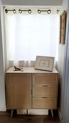 a desk with a laptop on top of it in front of a window at Chalet - Beach House in Gruissan