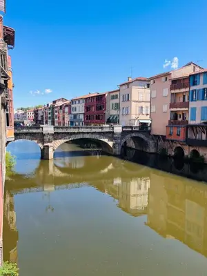 a bridge over a river in a city at Grand Hotel de Castres in Castres