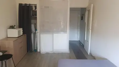a small kitchen with a refrigerator and a microwave at Peace and Quiet Mediterranean Wellbeing Bien-etre en Paix et calm in Narbonne