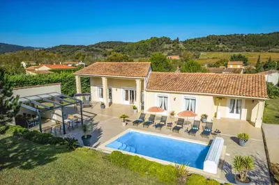 an aerial view of a house with a swimming pool at Villa Loupia by Villa Plus in Loupia