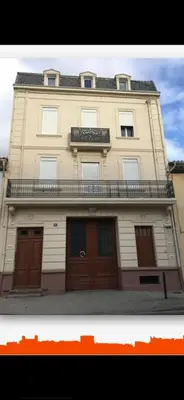 a large building with a balcony on top of it at Appartement spacieux à Lézignan-Corbières de 75 m² in Lézignan-Corbières