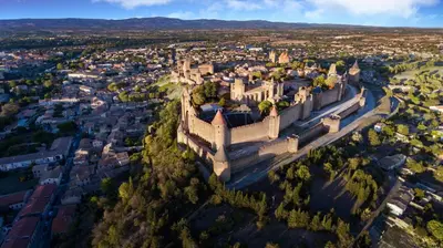 an aerial view of a city with a castle at L'Observatoire-Cité Médiévale in Carcassonne