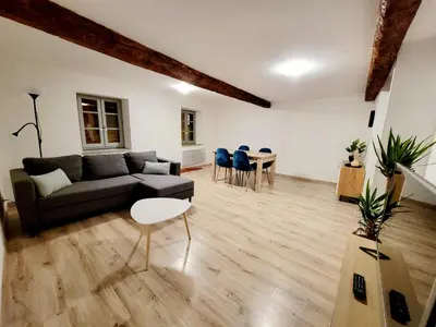 a living room with a couch and a table at L'Observatoire-Cité Médiévale in Carcassonne