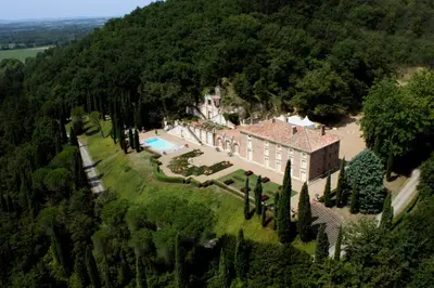 an aerial view of a house in a forest at Château de Roques in Teilhet
