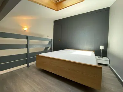 a bedroom with a large bed in a room at Appartement dernier étage à 300 m de la plage GN020-238 in Gruissan