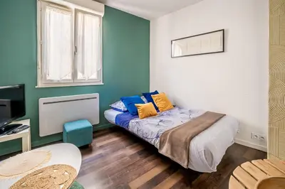 a small bedroom with a bed and a window at Joli studio Narbonne in Narbonne