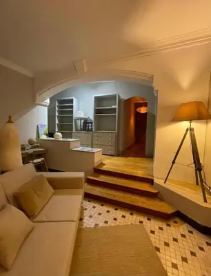 a living room with a couch and a table at Casa amore, cœur de ville in Carcassonne