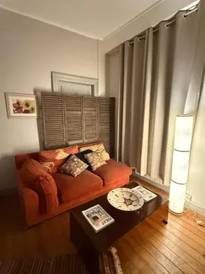 a living room with a couch and a coffee table at Casa amore, cœur de ville in Carcassonne