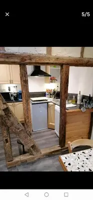 a kitchen with a stove and a stove top oven at bel appartement in Mirepoix