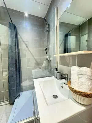 a bathroom with a sink and a mirror at Narbonne centre Dame Nature in Narbonne