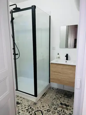 a glass shower in a bathroom with a sink at Henri ll l Terrasse l Proche gare & Centre ville in Castres