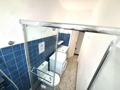 a bathroom with a toilet and a sink at Maison 2 pièces 4 couchages PORT LA NOUVELLE PN000-042 in Port-la-Nouvelle