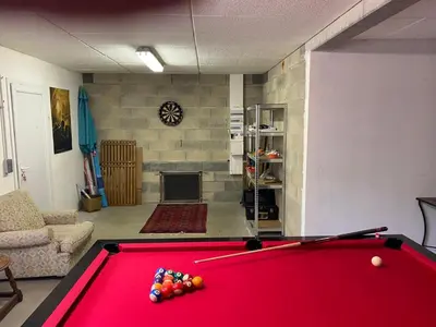 a living room with a red pool table at MAISON 119m2 in Revel