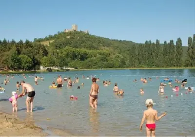 a group of people in the water at a lake at Gîte T3 terrasse Chalet in Puivert