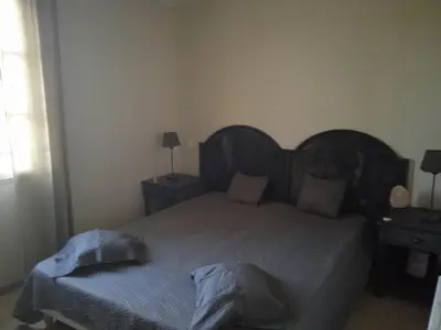 a bedroom with a bed with two pillows on it at Maison T3 avec spa in Saint-Laurent-de-la-Cabrerisse