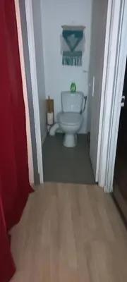 a small bathroom with a toilet in a hallway at Maison calme in Payrin-Augmontel