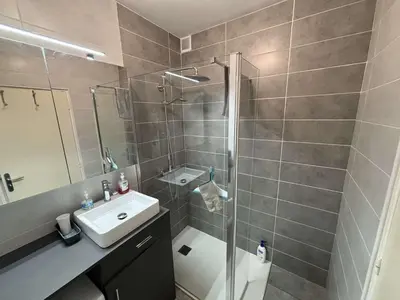 a bathroom with a shower and a sink and a toilet at Appartement deux pièces Port la Nouvelle PN015-017 in Port-la-Nouvelle