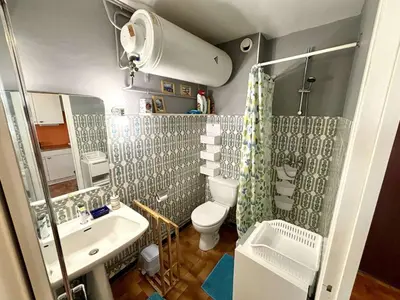 a small bathroom with a toilet and a sink at Studio 3 couchages PORT LA NOUVELLE PN040-004 in Port-la-Nouvelle