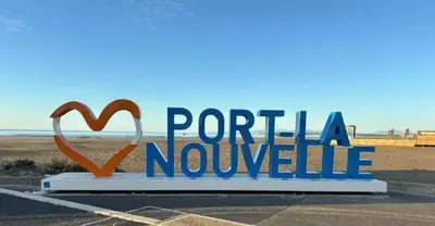 a sign in a parking lot with the words portilla novole at Studio 3 couchages PORT LA NOUVELLE PN040-004 in Port-la-Nouvelle