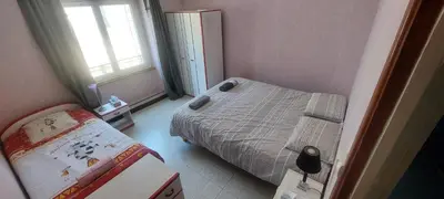 a small bedroom with a bed and a window at Maison Cosy à Rieux-Minervois in Rieux-Minervois
