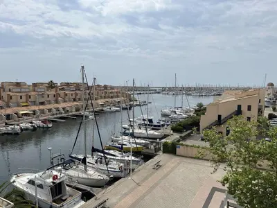 a group of boats docked in a harbor at Appartement dernier étage avec terrasse vue port GN400-028 in Gruissan