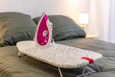 a surfboard sitting on top of a bed at Le Jasmin - Netflix Inclus in Narbonne