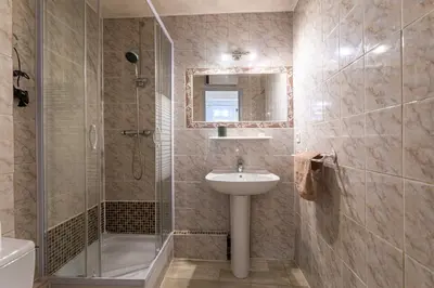 a bathroom with a sink and a shower at Le Jasmin - Netflix Inclus in Narbonne