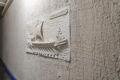a drawing of a boat on the side of a wall at Le Jasmin - Netflix Inclus in Narbonne
