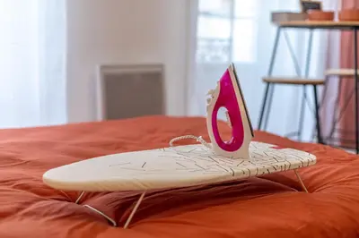 a surfboard with a pair of scissors on top of it at L'Ocre - Netflix Inclus in Narbonne