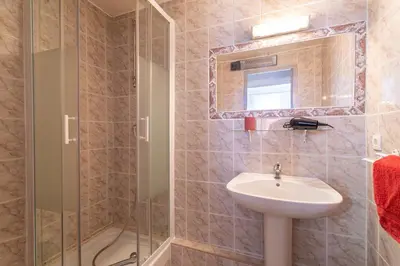 a bathroom with a sink and a shower at L'Ocre - Netflix Inclus in Narbonne