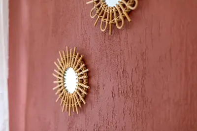 two wreaths on a red wall with a mirror at L'Ocre - Netflix Inclus in Narbonne