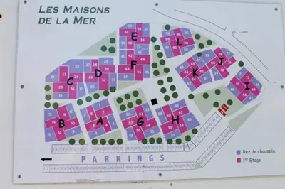 a map of a city with pink and purple buildings at Appartement avec parking privé proche de la plage GN250-089 in Gruissan