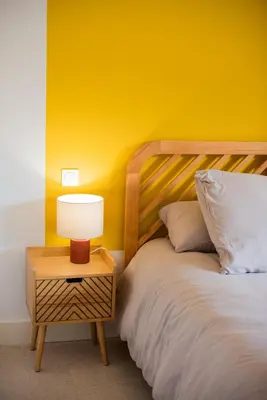 a bedroom with a bed and a window at Maison Nomade piscine privée, parking et clim in Carcassonne
